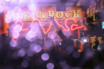 blurred background rock concert, night club, music, crowd of people a lot