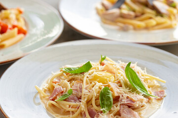 Pasta Carbonara with bacon and cream served on plate