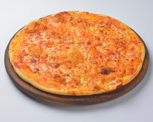 Pizza Margherita served on a round wooden board over white background.