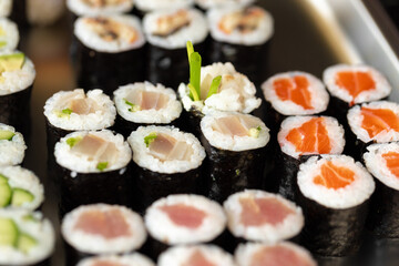 Set of maki sushi on metal tray