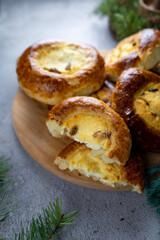 Traditional Russian baking pastry vatrushka, round buns, curd tart selective focus, closeup. Cheesecake with cottage cheese. Rustic food Photography.