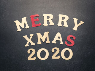 The words Merry Xmas 2020 on a chalkboard