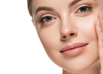 Obraz premium Beautiful woman face with healthy clean beauty skin close up
