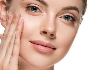 Fototapeta premium Beautiful woman face with healthy clean beauty skin close up