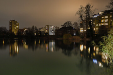 Lietzensee Park with adjacent buildings in the Berlin capital district of Charlottenburg on a winter December evening.