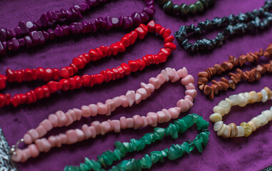 Set of mineral stones as amethyst, rhinestone, coral, lapis lazuli , woman accessorize