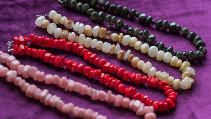 Set of mineral stones as amethyst, rhinestone, coral, lapis lazuli , woman accessorize