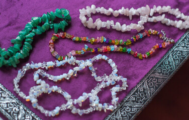 Set of mineral stones as amethyst, rhinestone, coral, lapis lazuli , woman accessorize