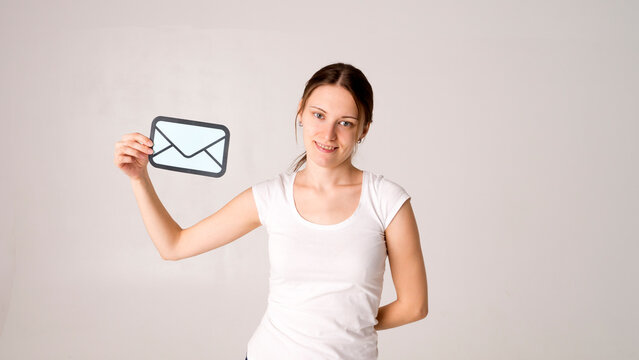 Woman hand holding a paper sheet with envelope message icon