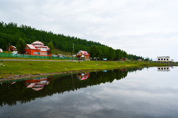 Obraz premium Beautiful countryside in Khuvsgul lake shore, MongoliaRural summer sunrise landscape with lake and dramatic colorful sky