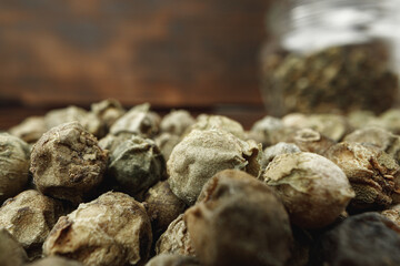 Macro photo of.green peppercorns on table