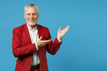 Smiling cheerful elderly gray-haired mustache bearded business man wearing red jacket suit standing...