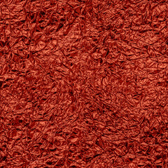 Seamless wrinkled metal foil texture, red color, grunge abstract background.