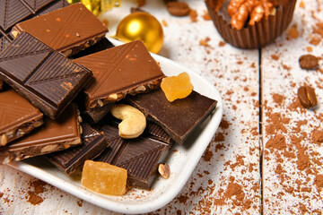 sweet food top view background for merry christmas or new year holiday decoration - chocolate candies, tangerines, cookies on white wood