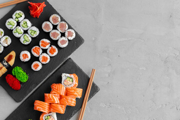 Maki sushi set served on black stone tray