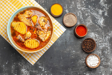 Above view of tomato chicken soup and spices set