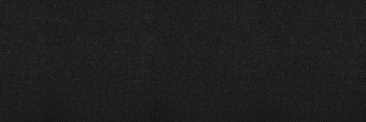 Black abstract background. Black fabric texture background. Wide banner.