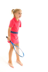 A little girl holds a tennis racket in her hands. Game, sports concept.