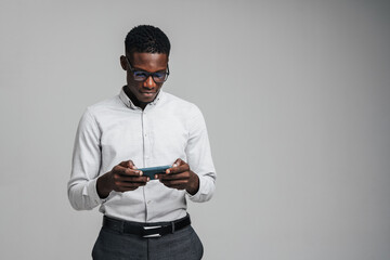 Handsome smiling young african busines man