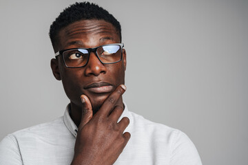 Closeup portrait of young african man thinking deeply