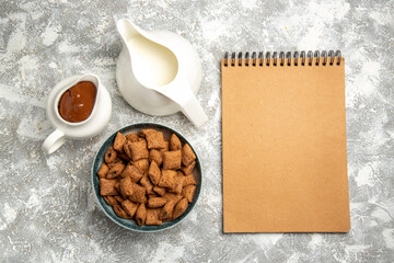 top view sweet pillow cookies with choco sauce on a white background sweet milk breakfast