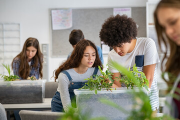 College students studying plants at biology lesson at school - obrazy, fototapety, plakaty