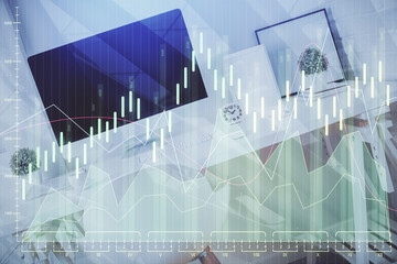 Double exposure of financial graph drawing and office interior background. Concept of stock market.