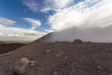 Clouds rising from crater of volcano