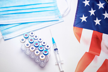 USA Vaccination, Coronavirus, USA flag, Vaccine vial dose, needle syringe, concept vaccination