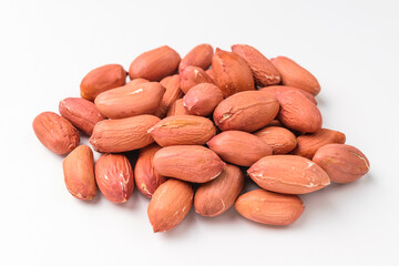 Raw peanuts on a white background