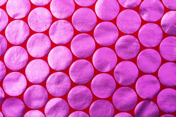 Red fabric with big pink circles of foil