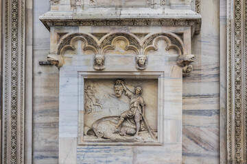 Architectural fragment of Milan Cathedral (Duomo di Milano, 1386), dedicated to St Mary of the Nativity (Santa Maria Nascente), with Gothic and Lombard Romanesque style. Milan, Italy.