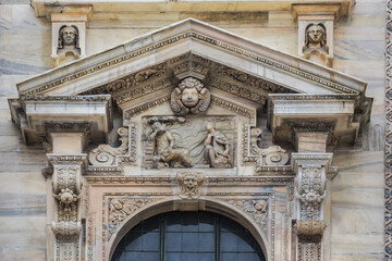 Architectural fragment of Milan Cathedral (Duomo di Milano, 1386), dedicated to St Mary of the Nativity (Santa Maria Nascente), with Gothic and Lombard Romanesque style. Milan, Italy.