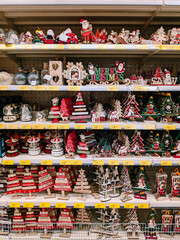 Fototapeta na wymiar Christmas wooden toys on the shelves in the store.