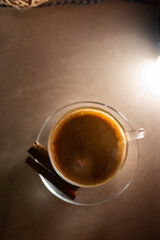 A cup of hot coffee latte cappuccino with cinnamon