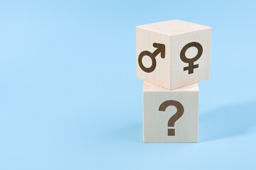 selection or changing gender concept. hand turns cube with the male and female icons over the cube with question icon