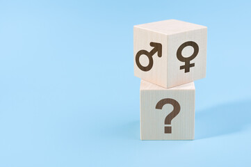 selection or changing gender concept. hand turns cube with the male and female icons over the cube...