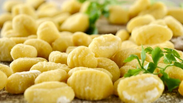 raw gnocchi falling in slow motion