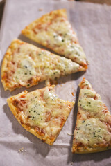 Four cheese pizza with tomato sauce 
