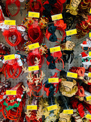 Fototapeta na wymiar Christmas horns, bows and hats on the shelves in the mall.