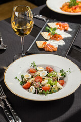 dining table set with appetizer and drinks in restaurant