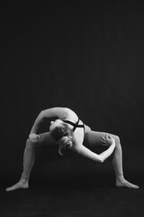 Black and white photo of yoga girl performing asana.
