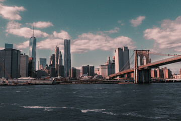 Fototapeta premium View of the New York City, with the Brooklyn Bridge over the river.