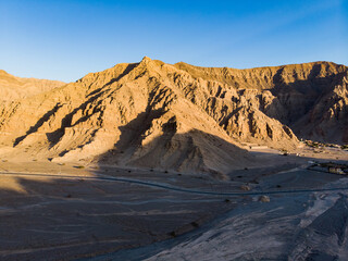 Fototapeta na wymiar Jebel Jais mountain desert road surrounded by sandstones in Ras al Khaimah aerial view