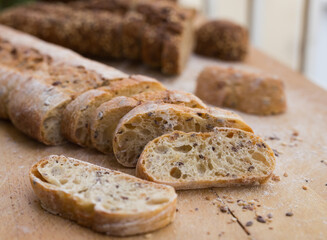 fresh loaf of bread on wooden board