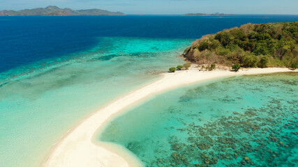 aerial seascape tropical island with sand bar, turquoise water and coral reef. Ditaytayan, Palawan, Philippines. tourist boats on tropical beach. Travel tropical concept. Palawan, Philippines