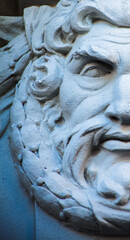 God Zeus. The king of the gods the ruler of mount Olympus and the god of the sky and thunder. Close up ancient statue. Selective focus on eye.