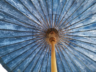 Under oriental beautiful blue umbrella