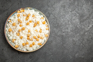 Overhead view of easy-make ahead peas and rice meal for dinner on dark background