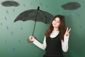 Pre-adolescent girl holding painted black umbrella